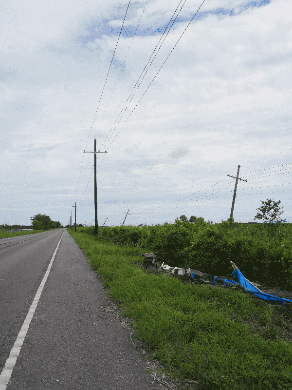 New utility poles (left) and damaged utility poles (right), Falgout Canal Road, Terrebonne Parish, Louisiana, July 2022